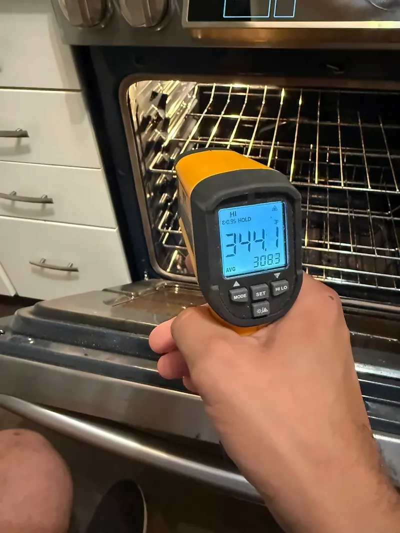 Checking an oven's temperature with an infrared thermometer